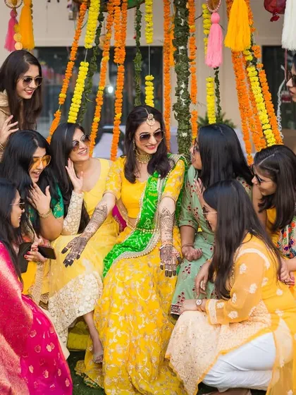 The bride and her friends sharing secrets and laughter during a Mehendi function. We love capturing the bond between a bride and her bridesmaids.