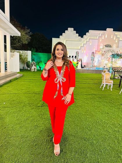 Another look at this stunning red co-ord set. It's a versatile outfit that can be dressed up or down for any occasion.