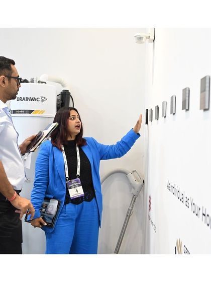 Our founder, Neha, demonstrates our range of smart keypad options to a client. In the background, you can see the integrated Drainvac system, showcasing how we combine intuitive control with powerful air quality hardware for a complete home wellness package.