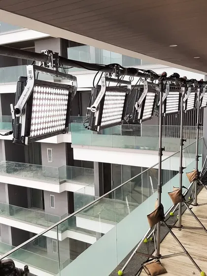 This setup shows a line of IP65 rated Creamsource Vortex8 lights rigged on a balcony for a high rise shoot. Using a pipe and stand system allows us to create a long, continuous source of light even in tight spaces.