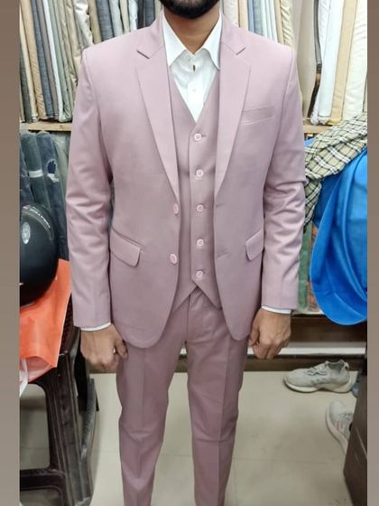 A client happy with his dusty pink three piece suit. I offer tailoring in a wide range of colors, allowing you to get a unique suit that perfectly matches your personal style and the occasion.