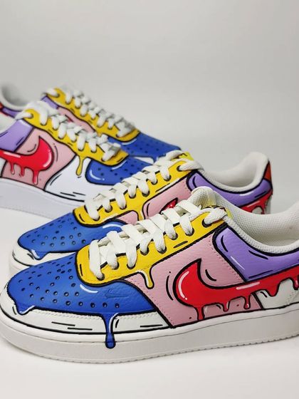 Two pairs of the hand-painted 'Drip' Nikes, perfect for a company looking for coordinated but not identical custom merchandise for their employees or as event giveaways.