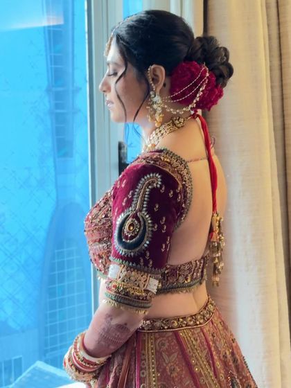 The bride in profile, showing how the bun is positioned for a graceful silhouette.