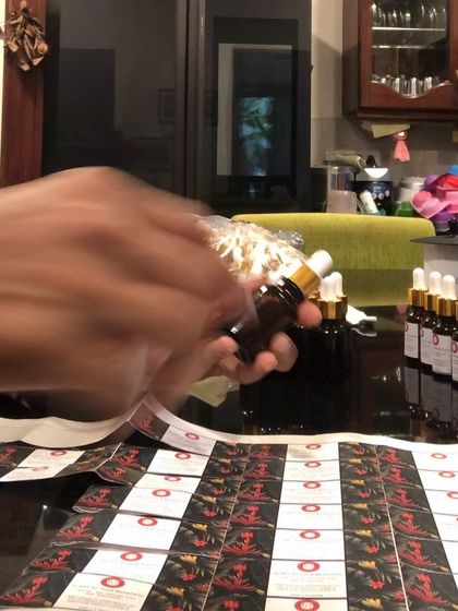 Getting ready for a festive pop-up. Here I am labeling my face oils, preparing for a busy day of meeting customers and sharing my creations.