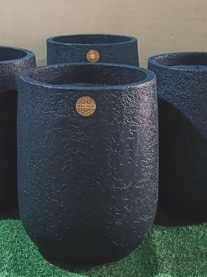 A cluster of my glass-shaped planters in a textured black finish, ready to be shipped to their new home in Goa.