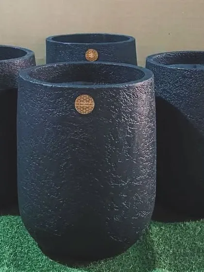 A cluster of my glass-shaped planters in a textured black finish, ready to be shipped to their new home in Goa.