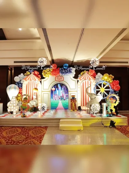 An elaborate carnival stage with multiple circus tent backdrops, a Ferris wheel prop, and various animal characters. The detailed setup creates a spectacular and lively carnival scene.