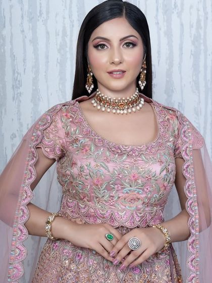 A perfect party soft glam look. The makeup is elegant and polished, with a focus on glowing skin and beautifully defined eyes, suitable for any special occasion.