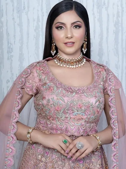 A perfect party soft glam look. The makeup is elegant and polished, with a focus on glowing skin and beautifully defined eyes, suitable for any special occasion.