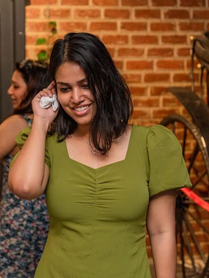 A guest enjoying the mystery-themed decor. The details, like the vintage carriage, are what make the atmosphere here so special.