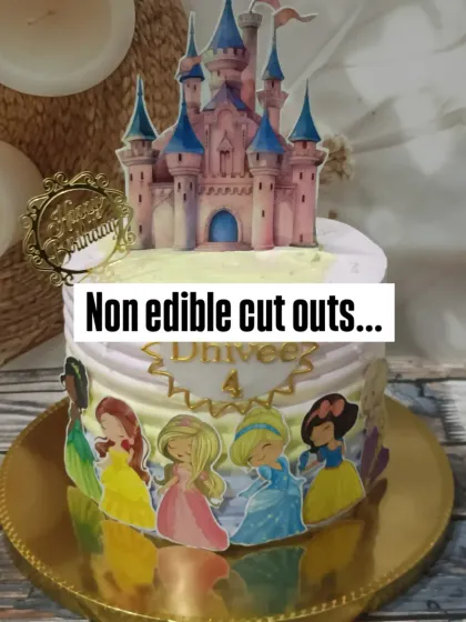 A fairytale dream for a princess party. This cake features a Disney Princess theme with a beautiful castle topper and character cutouts around the base.