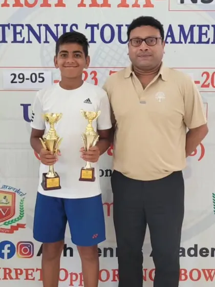 Vivaan with an official after winning the singles and doubles titles at the National Series in Hyderabad.