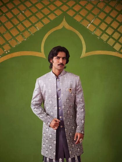 An Indo-Western sherwani from the Nazaakat collection, featuring a beautiful gradient pattern. This piece is paired with a matching kurta for a complete, elegant look.
