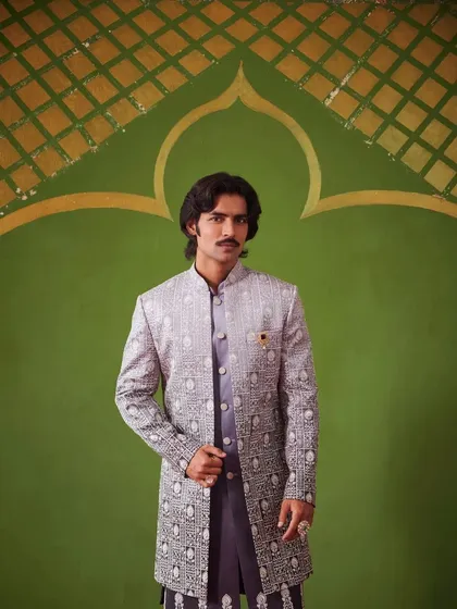 An Indo-Western sherwani from the Nazaakat collection, featuring a beautiful gradient pattern. This piece is paired with a matching kurta for a complete, elegant look.