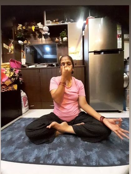 My mom practicing Nadi Shodhana, or alternate nostril breathing. This pranayama technique is excellent for calming the mind, balancing energy, and reducing stress.