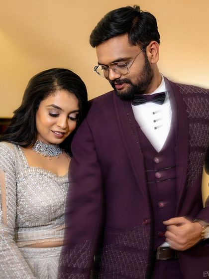 A quiet, tender moment amidst the celebration, as the bride rests her head on the groom's shoulder.