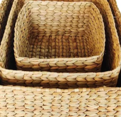 A set of three nesting baskets woven from natural water hyacinth. These square-shaped baskets are perfect for organizing smaller items on shelves or inside drawers, offering a flexible and eco-friendly storage solution.