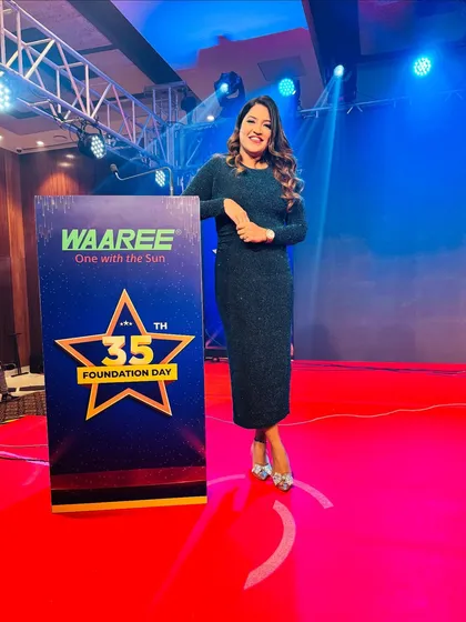 Posing by the 35th Foundation Day branding for Waaree Group. I enjoy hosting corporate milestones and celebrating a company's journey of excellence.