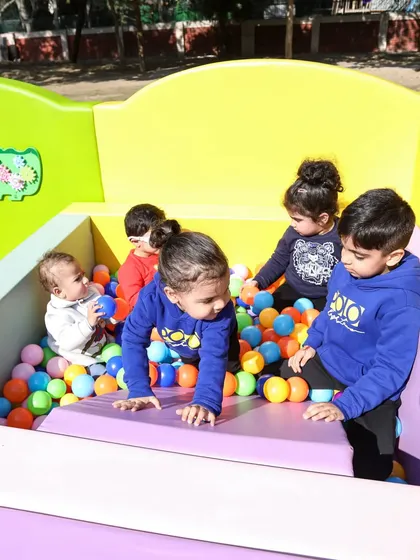 A group of friends making memories in the ball pit. It's the perfect spot for social play.