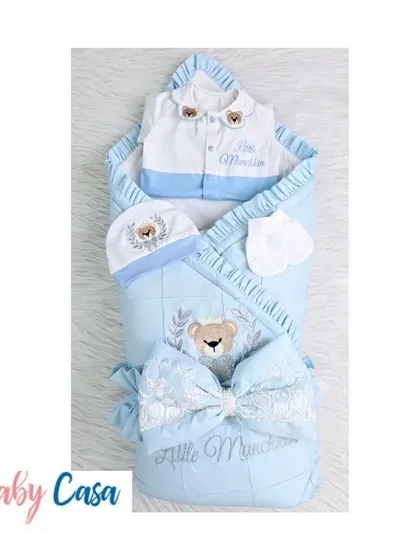 The "Little Munchkin" combo set in blue and white. This complete package includes a personalized wrap, a two tone romper, and a matching cap and mittens with a teddy bear theme.
