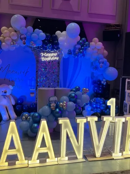 The stage viewed under dramatic blue lighting, enhancing the "up in the sky" feel of the theme.