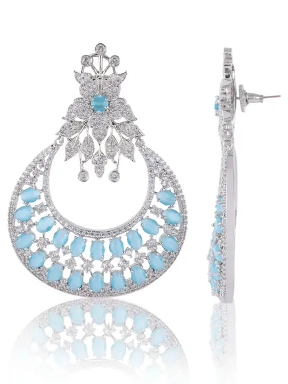 A profile and front view combination of the earrings. This type of shot is crucial for e-commerce as it shows the product's depth and how it is constructed, including the post and backing.