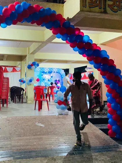 The entrance arch for the Mickey Mouse birthday party, with red and blue balloons welcoming guests.