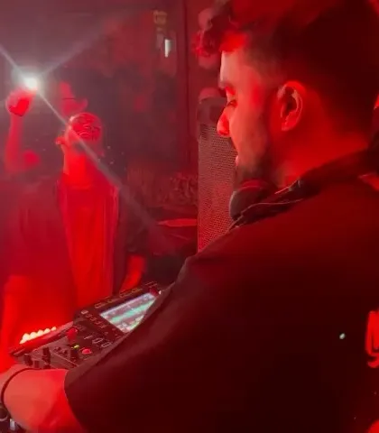 A duplicate of 130, capturing the intense focus required to DJ.