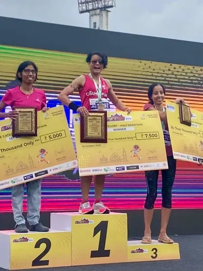 The proof is in the performance. Here I am on the podium after winning 1st place in my age category at the Bengaluru Marathon. I don't just teach this stuff; I live it, and I use the same training principles to help my team and myself achieve our goals.