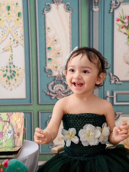 This little girl's happy laugh is infectious. A beautiful, candid moment from a simple, elegant studio session.
