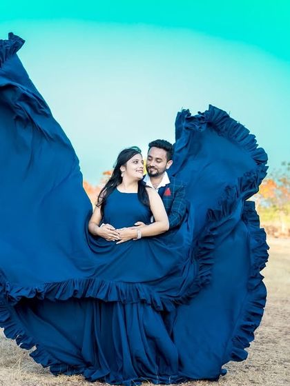 Another angle of the dramatic blue "flying gown". This dress is guaranteed to make your pre-wedding photos stand out.