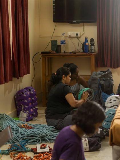 Our team sorting through ropes, helmets, and harnesses. We meticulously check all our gear to ensure it's safe and ready for our participants.