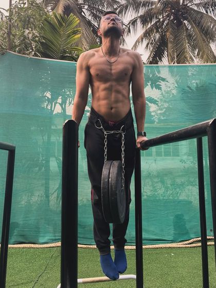 This student's progress is incredible. The calisthenics gains are visible in his defined physique, built with weighted dips and other bodyweight exercises.