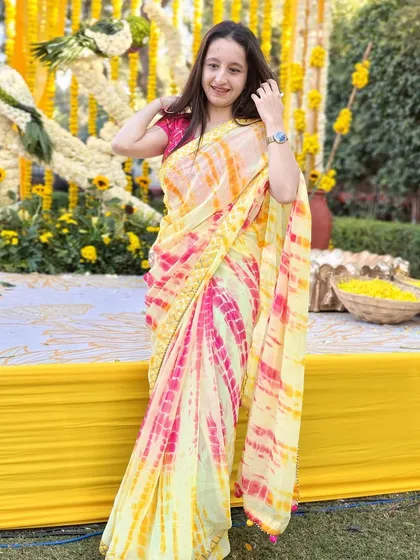 Haldi vibes from a beautiful winter wedding in Jaipur. This tie-dye saree was the perfect choice for the colorful and joyous occasion.