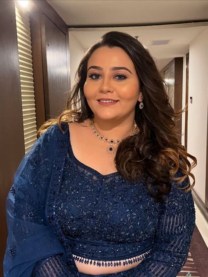 Anisha looking radiant and happy in her complete look, ready for her celebration.