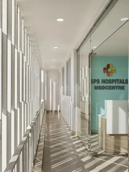 The facade of the SPS Hospitals Medcentre is designed to be simple yet functional. The vertical fins help control heat gain while allowing natural light to flood the interior, creating a bright and inviting ambience.