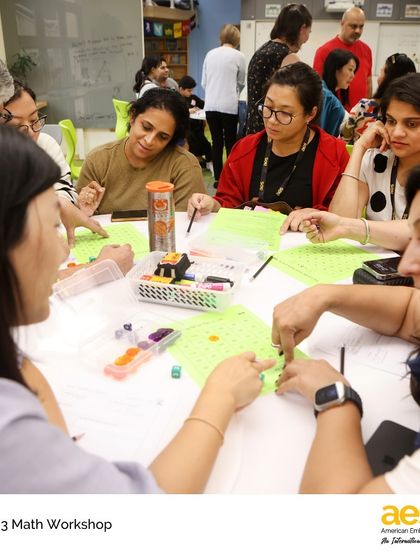 A table of parents works together to solve a "3 Act Task," gaining insight into our approach to building conceptual understanding in math.