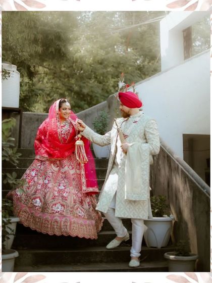 A candid moment of the groom leading his bride down the stairs, their interaction full of grace and affection.