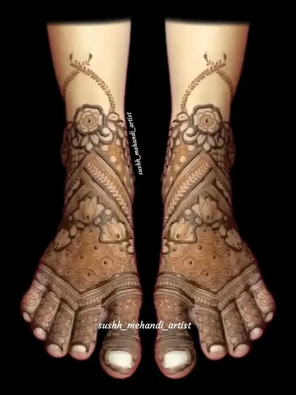 A delicate and graceful foot design with floral and vine patterns climbing up the ankle. This style is both modern and elegant.