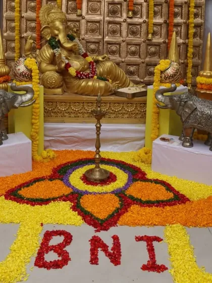 This is an example of decor for a corporate event with a traditional theme. For this BNI meet, I created a grand Ganesha installation with a detailed floral rangoli on the floor, combining professional branding with cultural elements.