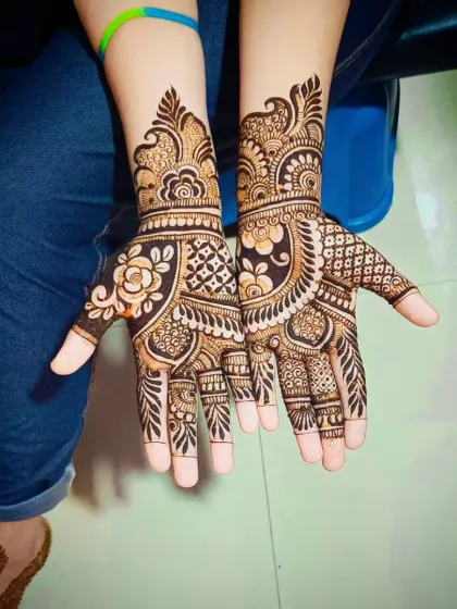 A top-down view of the same traditional design, showing the full palms and wrist work.