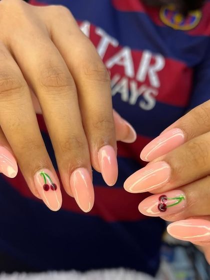 A simple, sweet, and summery design. This look features a glossy pink base with a single, perfectly hand-painted cherry on each hand for a touch of playful charm.