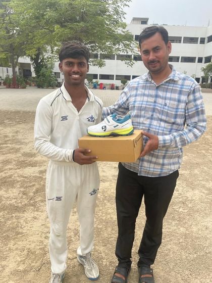 Rishi played a fantastic knock of 114 runs. Here he is receiving new cricket spikes for his performance.