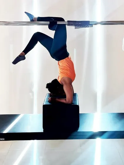This seemingly simple inverted pose on the Cadillac offers amazing benefits for strength, balance, and self discovery.