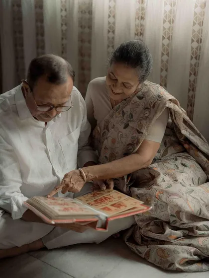 Flipping through their old wedding album, they relived the beginning of their journey. I felt like I was traveling back in time with them, witnessing a story written page by page, year by year.
