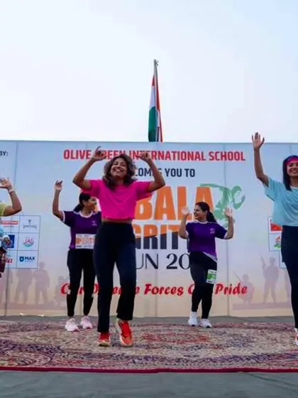 Performing on stage at the Olive Green International School for the Ambala Integrity Run. The Indian flag in the background makes it even more special.
