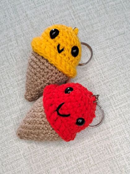 Another view of my amigurumi ice cream cone keychains. The red and yellow scoops have sweet smiling faces that are sure to brighten your day.