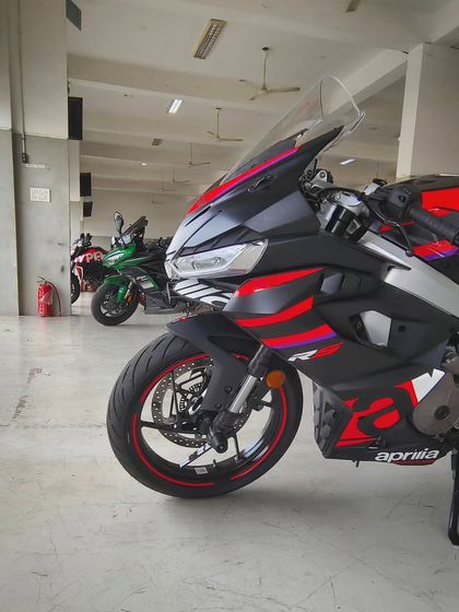 The Aprilia RS457 parked in the pit garage, ready for action. The excitement before the first session of the day is palpable.