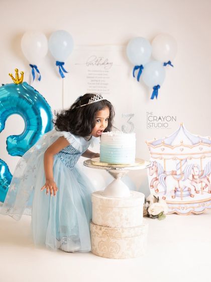 Can't resist. A funny moment as the birthday girl takes a big bite directly from her cake.