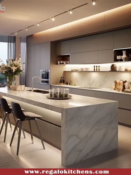 This open-concept kitchen is designed for seamless city living, with a stunning view as its backdrop. The long marble island with integrated seating is perfect for entertaining, while the handle-less cabinetry and under-cabinet lighting maintain a clean, contemporary aesthetic.
